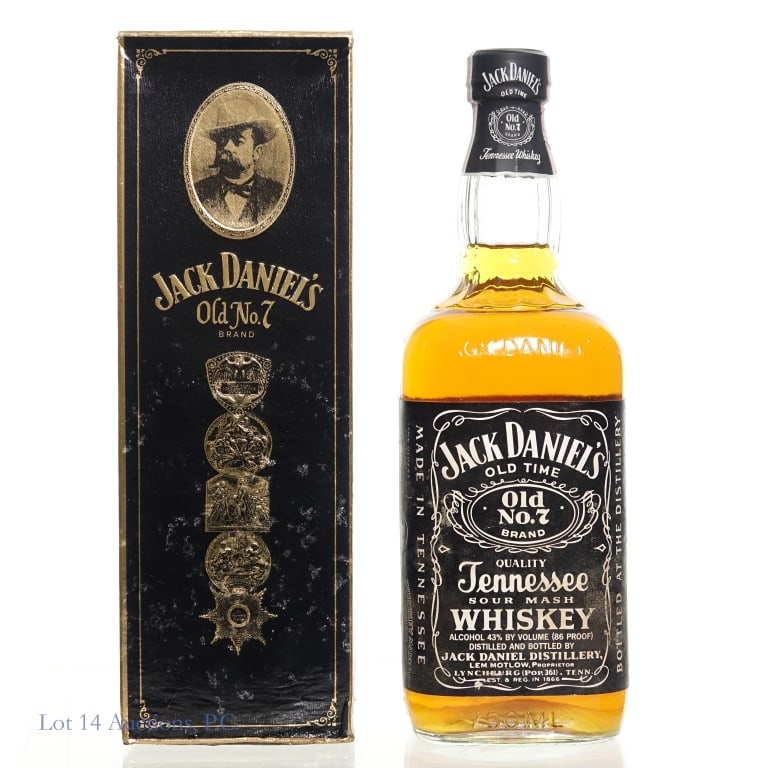 1989 Jack Daniel's False Seal Old No 7 TN Whiskey: 1989 Jack Daniel's Old No 7 Tennessee Whiskey in original box. "89" bottle molding. 86 Proof, 750ml. Water damage visible on the label and the box.