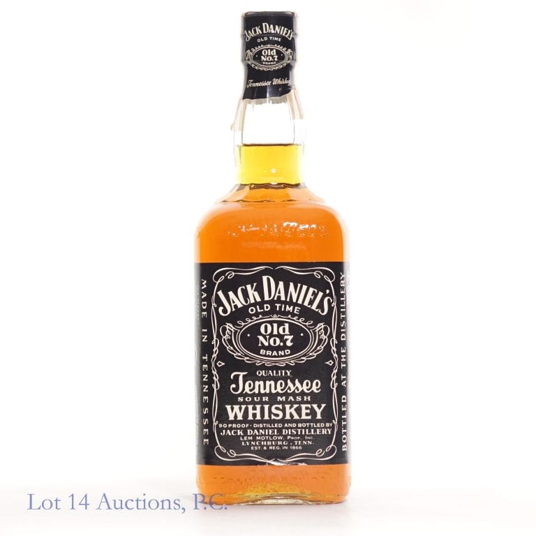 1980s Jack Daniel's Tennessee Whiskey (750ml): 1980s Jack Daniel's Tennessee whiskey. "81" glass mold. No series tax strip and cello wrap fully intact. 90 proof, 750ml. With a 1L gold medal cardboard box. See photos for