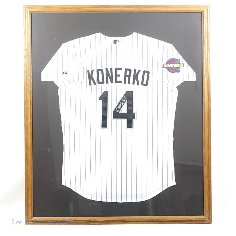 Paul Konerko Signed 2005 WS Jersey (Schwartz): *** LOCAL PICK UP or 3RD PARTY SHIPPING only. Lot 14 Auctions will NOT ship this lot in house. *** Framed #14 Chicago White Sox jersey with 2005 World Series patch visible on right shoulder. The "4" i