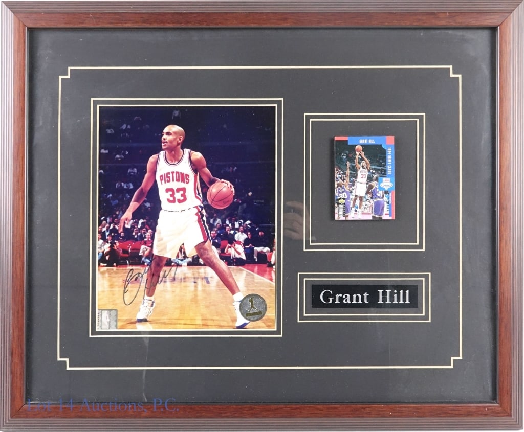 Grant Hill Signed Framed Picture (FoD Certed): LOCAL PICK UP OR THIRD PARTY SHIPPING ONLY. Color photograph of NBA Detroit Pistons basketball player Grant Hill. the photograph is framed along with a trading card and name plaque. The