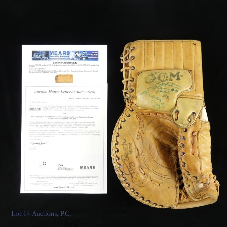 Hull Hall Mikita Esposito Signed Goalie Glove: 1960s era CCM Prolite ice hockey goalie glove. The palm area is signed by Stan Mikita (#21), Glenn Hall (#1), and Bobby Hull (#9). Tony Esposito (#35) has signed on the fingers side of the