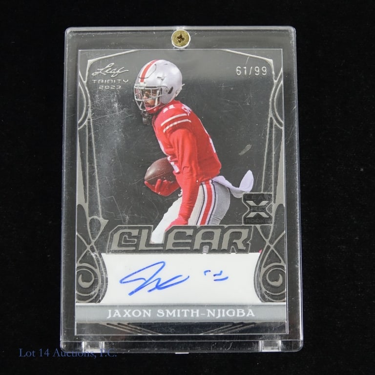 Jaxon Smith-Njigba 2023 Trinity Rookie Auto Card #61/99: Jaxon Smith - Njigba 2023 Leaf Trinity rookie auto numbered 61/99 clear card in acrylic protective holder.