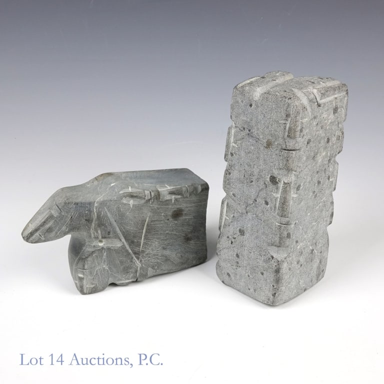 Inuit Sculptures - Lucy Tasseor Tutsweetok: Two small grey steatite sculptures by renowned Inuk artist Lucy Tasseor Tutsweetok (1934-2012), both featuring her iconic faces. The larger one measures approximately 5.5 x 2.25 x 2". The smaller