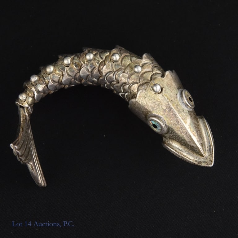 Sterling Silver Articulated Fish Bottle Opener: Sterling silver articulated fish bottle opener. Marked "Mexico" and "925". Approximately 4.5" long, weighs approximately 63.98g.