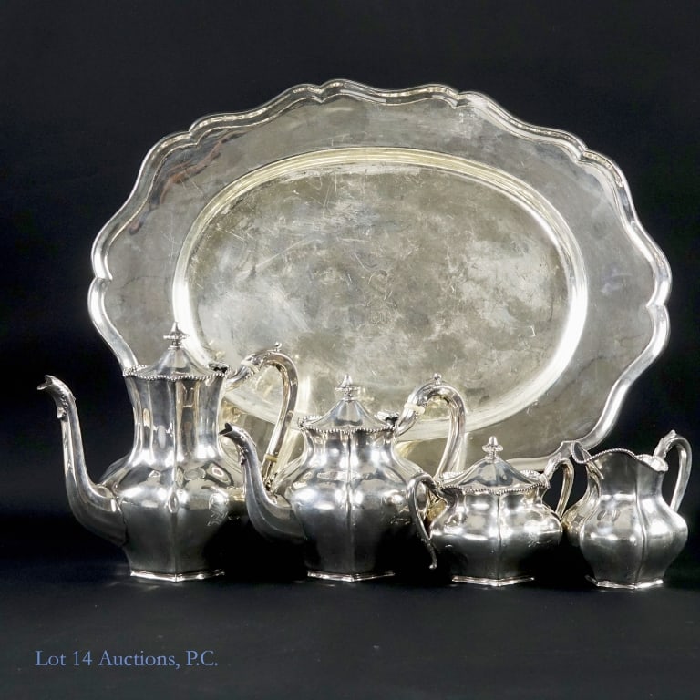 Reed & Barton Sterling Silver Tea & Coffee Svc, 5: Sterling silver tea and coffee serving set from Reed & Barton. Relevant hallmarks on the underside of each piece, alongside the number 104. Set includes: one teapot, approximately 8" tall and