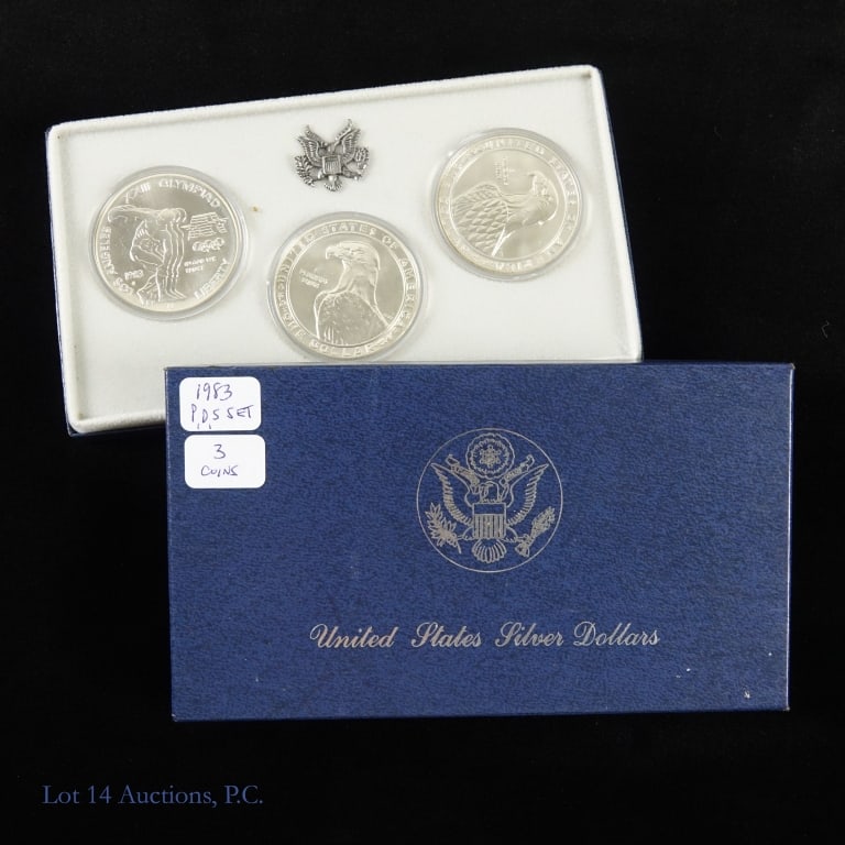 1983 P,D,S USA 90%-Silver Olympic 3-Coin Set OGP: 1983 P,D,S silver uncirculated Los Angeles Olympiad commemorative dollar 3-coin set (Philadelphia, Denver, San Francisco Mints) in blue OGP with COA. To commemorate the 1984 Los Angeles summer