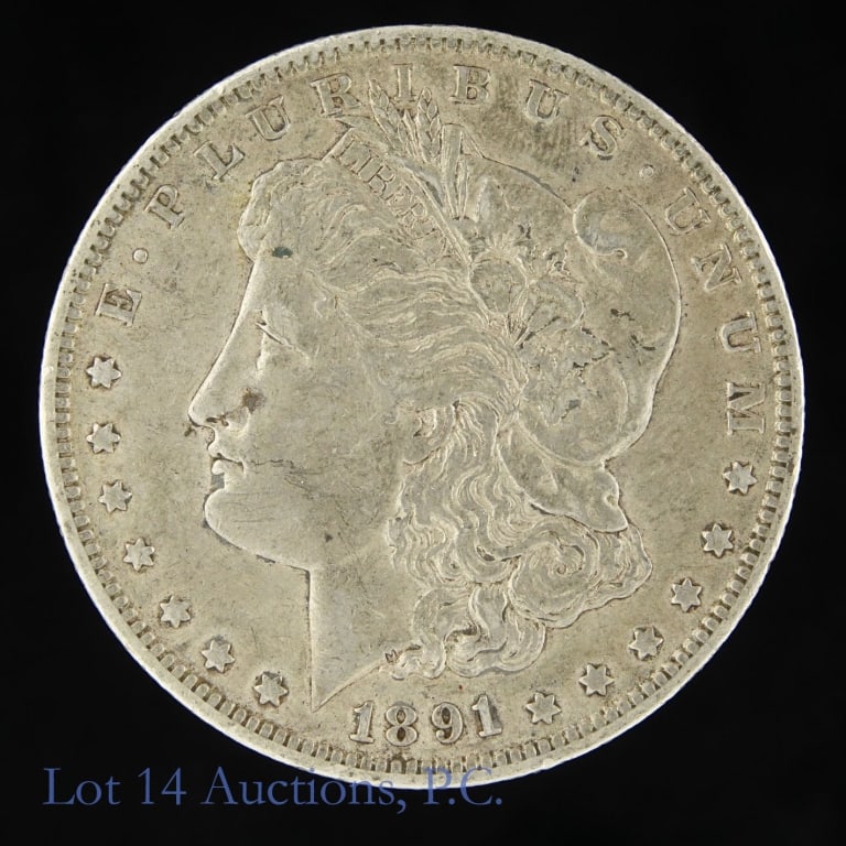 1891-O US Silver Morgan Dollar (Better Date!): 1891-O United States silver Morgan dollar (New Orleans Mint). Designer is George T. Morgan. Per consigner, a better date. Metal is 90% silver and weighs 26.73 grams. Mintage is 7,954,529. Silver