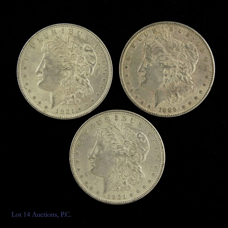 1889 & 1921 US Silver Morgan Dollars, 3: Three (3) United States 90%-silver Morgan dollars (Philadelphia Mint) as follows: ---1889 (P) (1); and ---1921 (P) (2). Silver content confirmed on Lot 14 Auctions electronic metal verifier and weighs