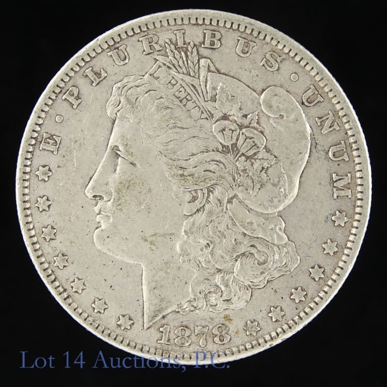 1878 7TF US Silver Morgan Dollar (1st Year Issue): 1878 (P) United States silver Morgan dollar (Philadelphia Mint). Designer is George T. Morgan. Per consigner, first year of issue and not a commonly found date. Metal is 90% silver and weighs 26.73 gr