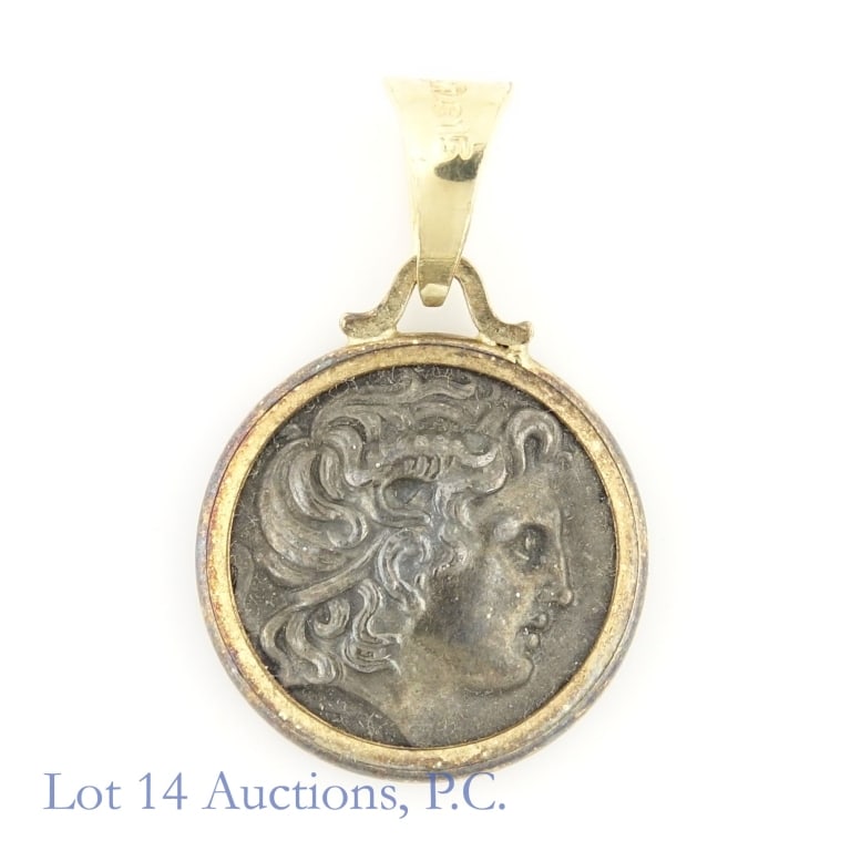Ancient Reproduction Coin in Gold Bezel: Vintage pendant featuring reproduction of ancient Greek coin in gold bezel. Bezel has the following lettering: "585 (Alpha character) (Omega character) E 15". Weighs 3 grams. *** Lot 14 Auctions is no