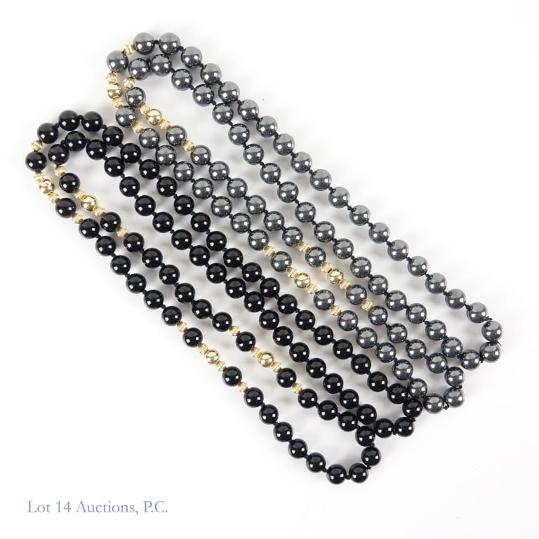 Hematite/14K YG & Nephrite/14K YG Necklaces (2): Hematite and 14K yellow gold necklace and a matching black nephrite and 14K yellow gold necklace. Each necklace approximately 36" long. See photos for details.