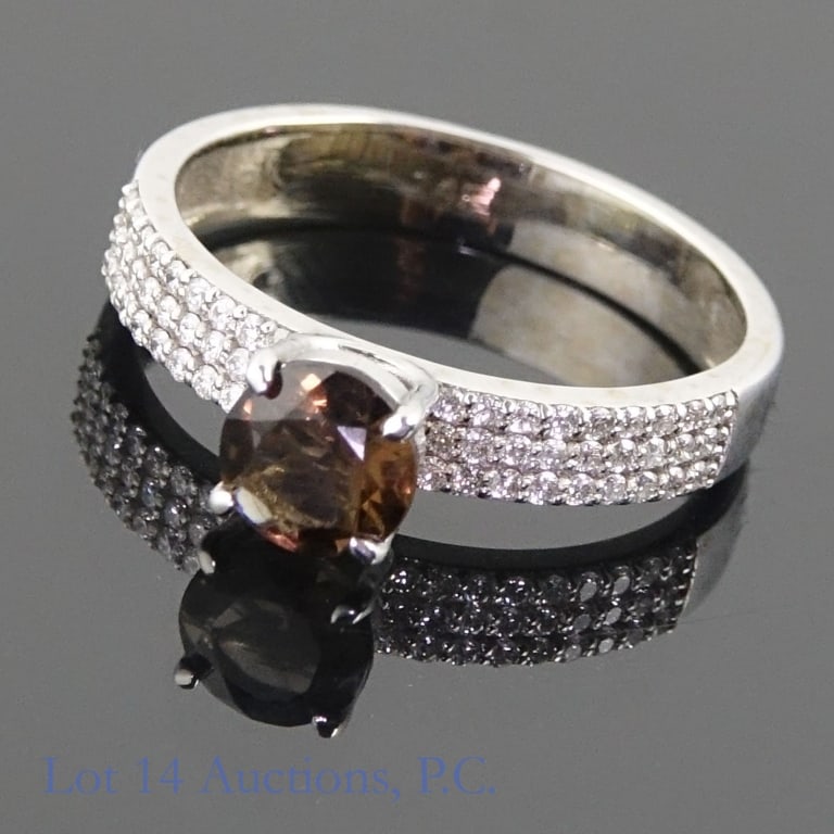 14k White Gold Ring w/ Diamonds and Smoky Quartz: Size 7 ring made with 14k white gold, decorated with one smoky quartz with many melee diamonds on either side (0.75 ct smoky quartz, 0.27 cttw diamonds). Total weight of ring is approximately 2.86g. I