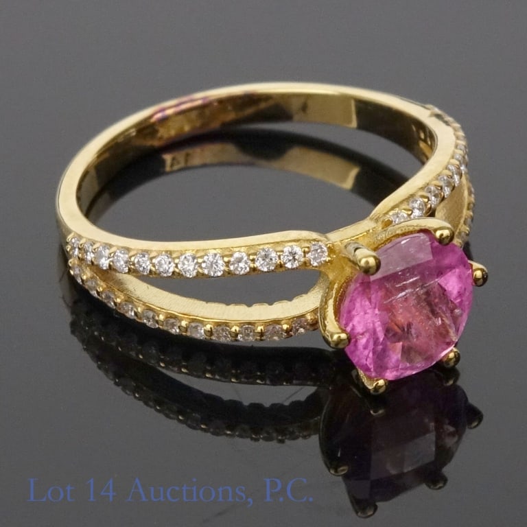 14k Yellow Gold Pink Tourmaline & Diamonds Ring: Size XX ring made with 14k yellow gold, decorated with a large pink tourmaline surrounded by melee diamonds (1.25ct pink tourmaline, 0.24 cttw diamonds). Total weight of ring is approximately