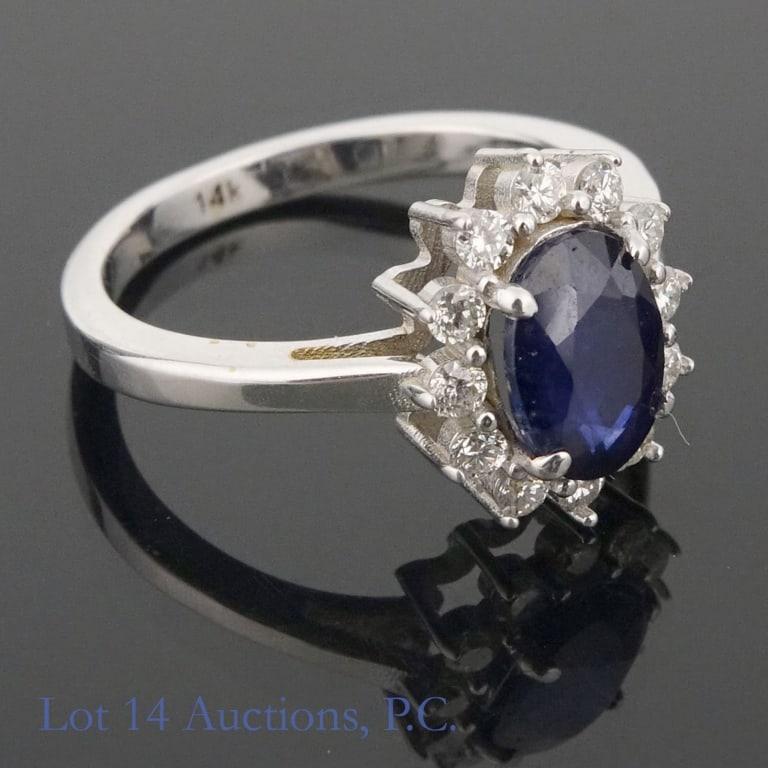 14k White Gold Sapphire & Diamonds Ring: Size 6 ring made with 14k white gold, decorated with a large sapphire surrounded by diamonds (1.80 ct sapphire, 0.30 cttw diamonds). Total weight of ring is approximately 3.33g. Identification
