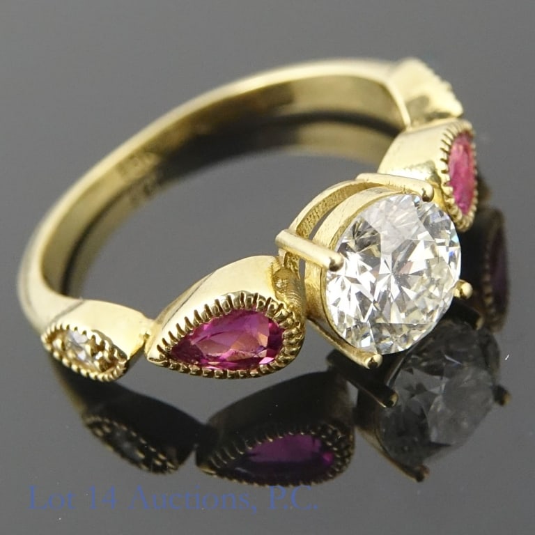18k Yellow Gold Diamond & Pink Tourmaline Ring: Size 6.5 engagement style ring made with 18k yellow gold, decorated with diamonds and pink tourmaline (0.25 ct diamond center, 0.40 cttw pink tourmaline, 0.16 cttw diamond sidestones). One of the