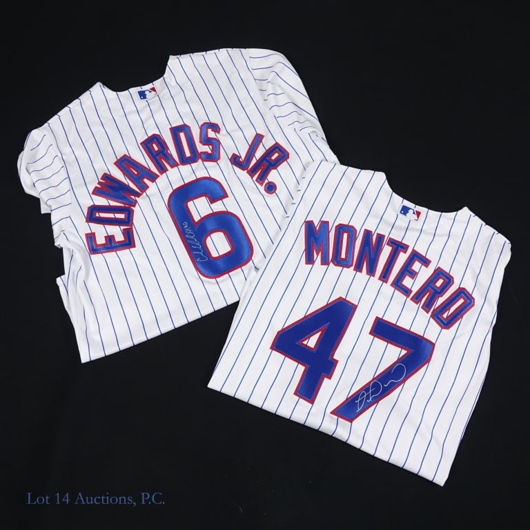 Edwards Jr & Montero Signed Cubs Jerseys: Two jerseys, one signed by Carl Edwards Jr. and the other by Miguel Montero. Carl Edwards signed across the numeral 6 on the back of a size Large Majestic jersey with a silver Sharpie. This