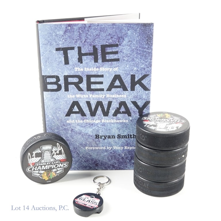 5 Blackhawks Signed Pucks & 1 Book: Five pucks with the 2015 Stanley Cup Champions logo. Each puck has one signature from a former Blackhawks player. You will find signed checks from Antti Raanta *** Eddie Olczyk *** Pat Foley