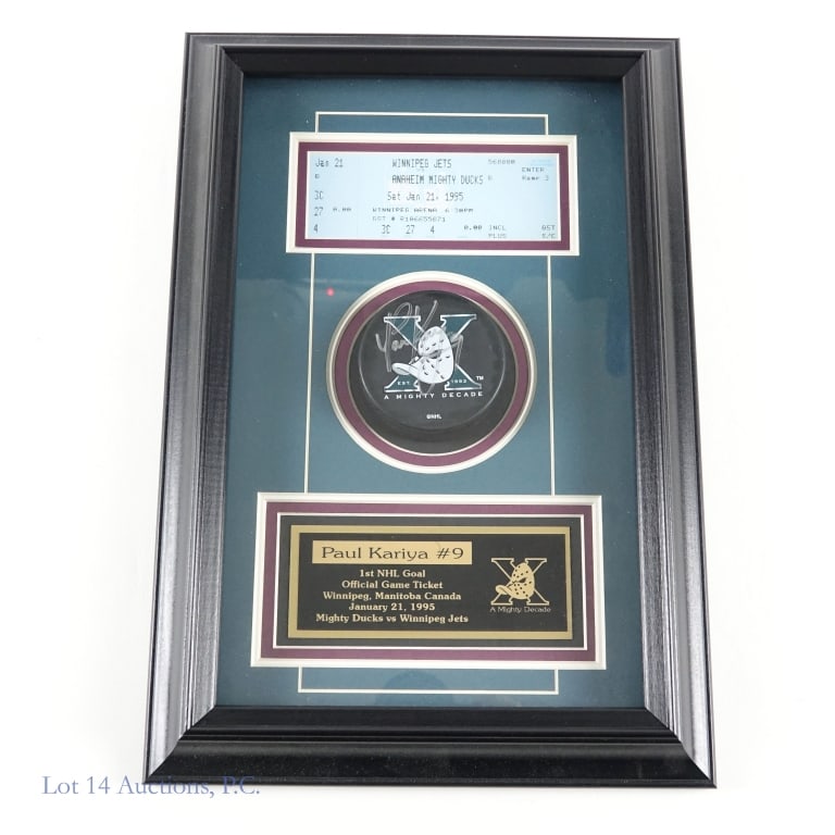 Paul Kariya Mighty Ducks Framed Display: Framed display honoring Paul Kariya - Hall of Fame NHL player for the Anaheim Mighty Ducks. Frame includes a Mighty Ducks "A Mighty Decade" branded hockey puck signed by Paul Kariya. Also includes a g