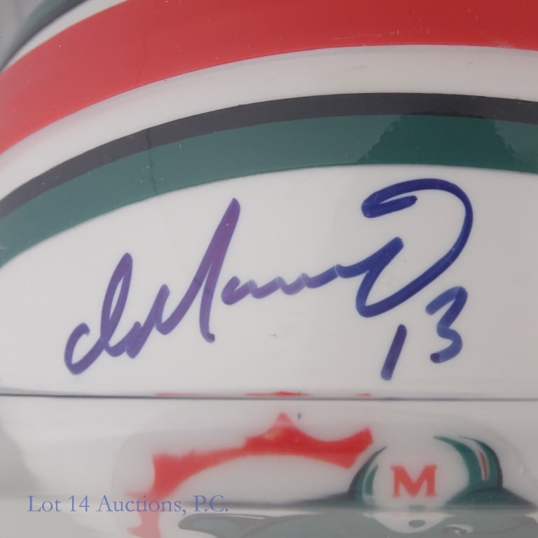 Dan Marino Signed Dolphins Mini Helmet COA: Dan Marino signed Miami Dolphins mini helmet. Gridiron Authentics COA with photograph.
