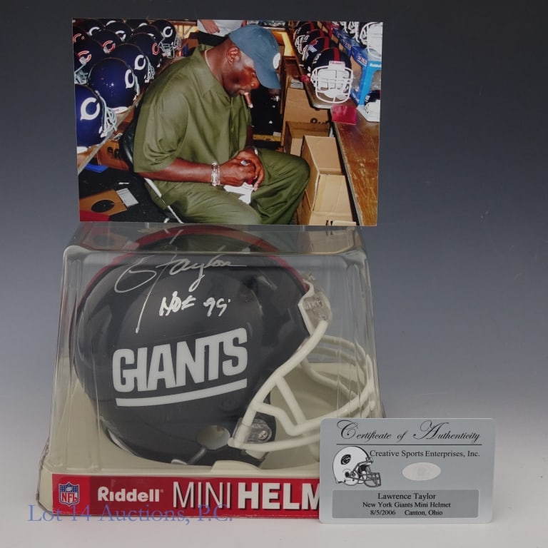 Lawrence Taylor Signed Giants Mini Helmet: Lawrence Taylor signed New York Giants mini helmet. Creative Sports Enterprises COA and signing photograph. Signed in Canton, OH om 8/5/2006.