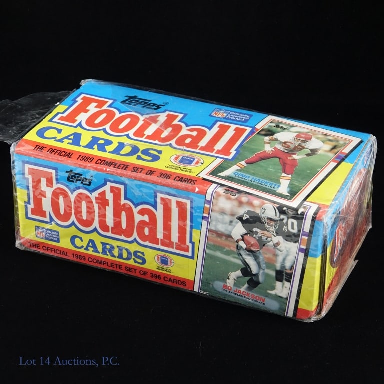 1989 Topps Football Factory Set: Factory sealed set of 1989 Topps football cards. The box remains sealed however the original plastic wrapping applied at the factory has torn in some places.