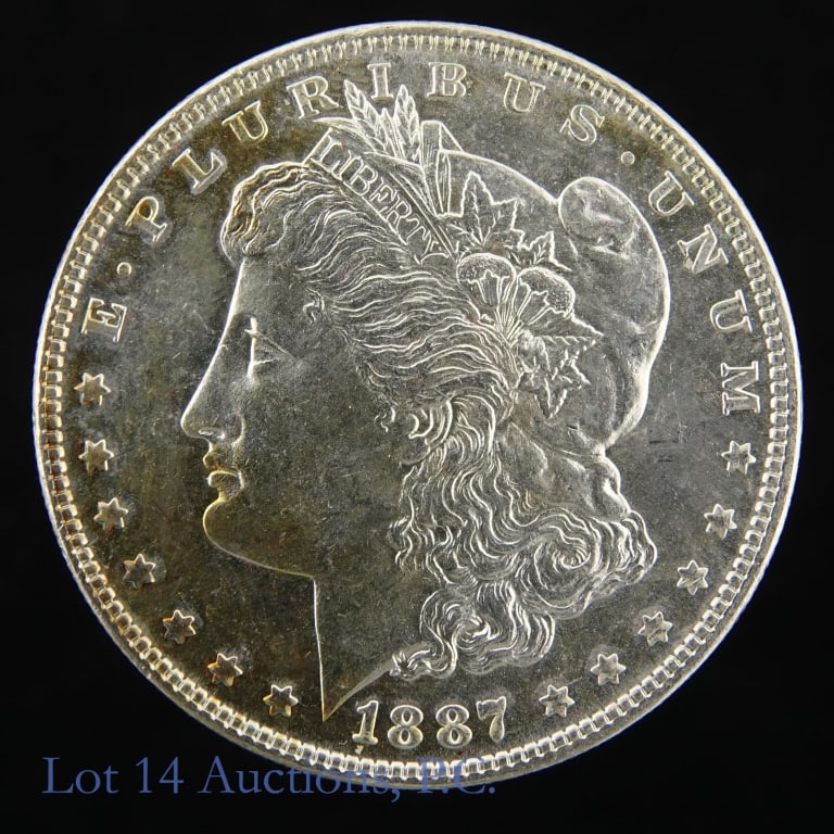 1887 (P) US Silver Morgan Dollar (*P/L BU): 1887 (P) United States silver Morgan dollar (Philadelphia Mint). *Per consigner, clean cheek with partial toning on obverse in semi proof like BU condition. Metal is 90% silver and weighs 26.73 grams.