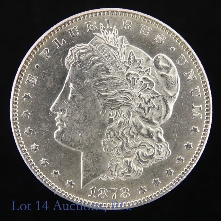 1878 (P) 7TF US Silver Morgan Dollar (*BU): 1878 (P) United States silver Morgan dollar (Philadelphia Mint) 7 tail feather variety. *Per consigner, first year of issue, not commonly found date and in BU condition. Metal is 90% silver and weighs
