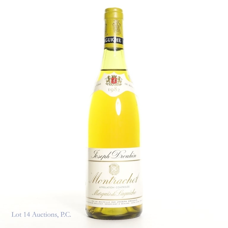 1982 Joseph Drouhin Montrachet Marquis de Laguiche: 1982 Joseph Drouhin Montrachet Grand Cru Marquis de Laguiche. 750ml., no stated abv. Small amount of sediment visible and some minor damage to capsule. Please see photos for fill level,