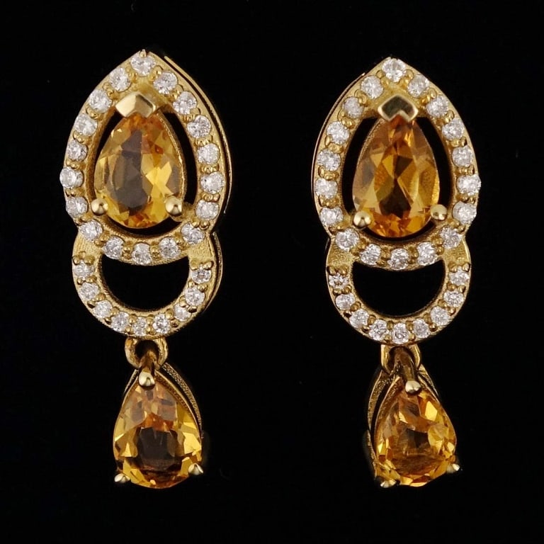 14k Y Gold Citrine and Diamond Drop Earrings: Pair of earrings made with 14k yellow gold, decorated with two citrines and 27 diamonds EACH (2.00 cttw citrines, 0.34 cttw diamonds). Total weight of both earrings is approximately 3.13g. Identificat