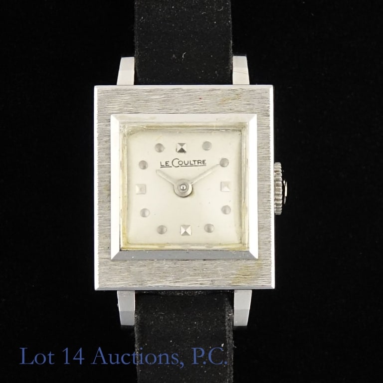 LeCoultre 14K White Gold Ladies' Watch Vintage: Vintage LeCoultre ladies' hand wound wrist watch. Gray dial with applied dot hour markers. 14K white gold case approximately 15.2 mm wide and 17.3 mm tall not including lugs. Corfam Kreisler band. Wat