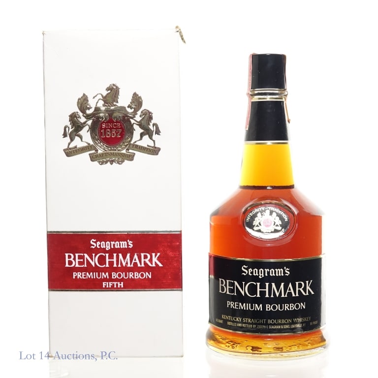 60s/70s Seagram's Benchmark Premium 6Y Bourbon: Seagram's Benchmark Premium 6 Years Old Bourbon. 4/5 Quart, 86 Proof. 60s/70s Series 112 tax strip fully intact. Original box included, showing minor damage and wear.