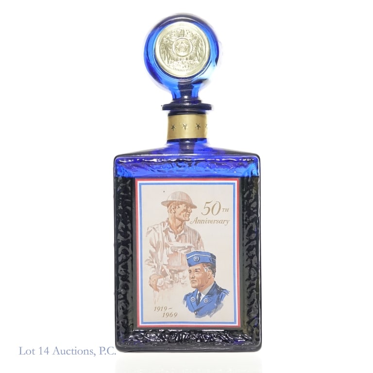 '69 J.W. Dant American Legion 50th Ann 10Y Bourbon: 1969 J.W. Dant 10 Years Old Bourbon. American Legion 50th Anniversary Commemorative Bottling. 4/5 Quart, 86 Proof. Tax strip fully intact. Approximately 1/2" below shoulder fill.