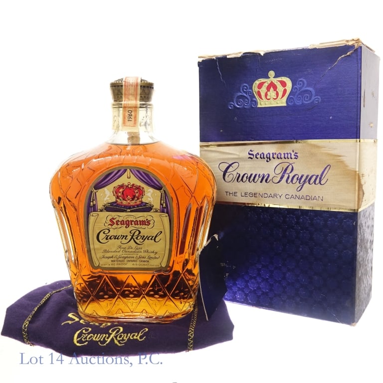 1960 Crown Royal Blended Canadian Whisky: 1960 Crown Royal fine deluxe blended Canadian whisky. 80 proof. 4/5 quart. Original box and drawstring bag included. Top flap on the box torn. Canadian tax strip fully intact. Plastic seal cracked ver