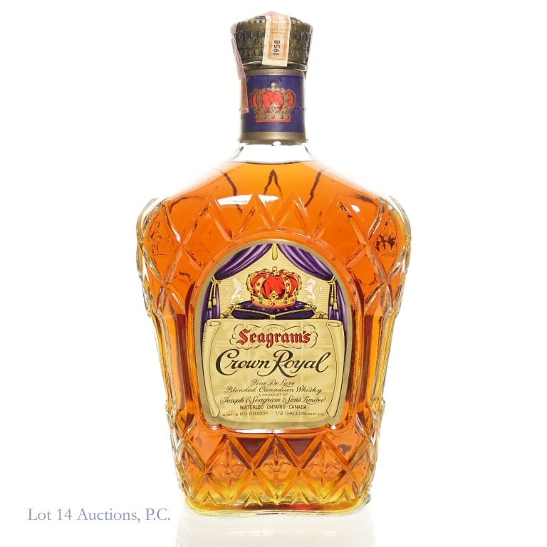 1958 Seagram's Crown Royal Canadian Whisky: 1958 Seagram's Crown Royal Canadian Whisky. 1/2 Gallon, 80 Proof. Bag and box not included. Canadian tax strips fully intact. US tax strip torn in one place.