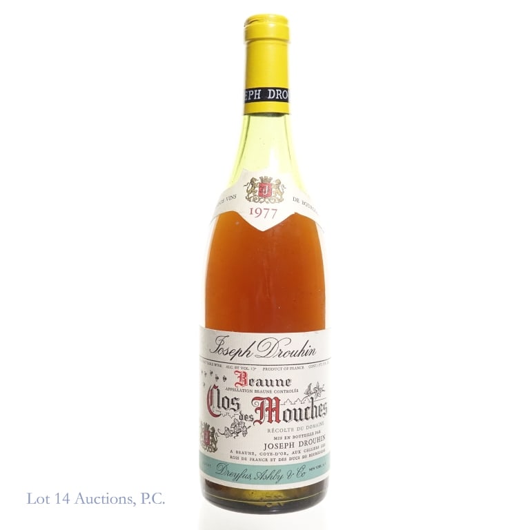 1977 Joseph Drouhin Beaune Clos des Mouches: 1977 Joseph Drouhin Beaune Clos des Mouches Bourgogne. 1 Pint 9 fl oz, 13% ABV. Consigned by the estate of a collector who stored wine and champagne bottles horizontally in the family's temperature-co