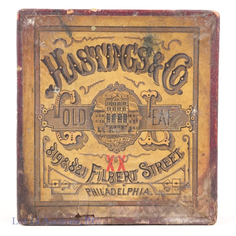 Hastings & Co. Gold Leaf In Original Box: Box of Hastings & Co. Philadelphia Gold Leaf. Box shows significant water damage but is fully intact. Some gold leaves have crumbled inside the box but most appear to be present and intact.