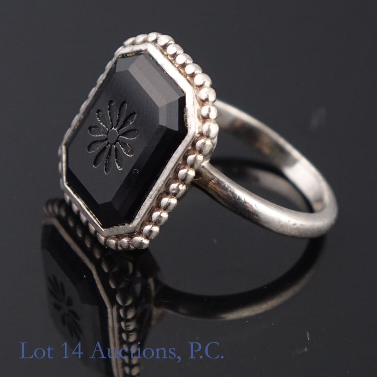 Tiffany & Co Sterling Silver Onyx Ring: Silver ring with octagonal onyx stone (7/16" x 9/16"). Stamped: "T & Co. AG 925 Italy". Size: 6.25 - 6.5. Weight: 5.3 grams.