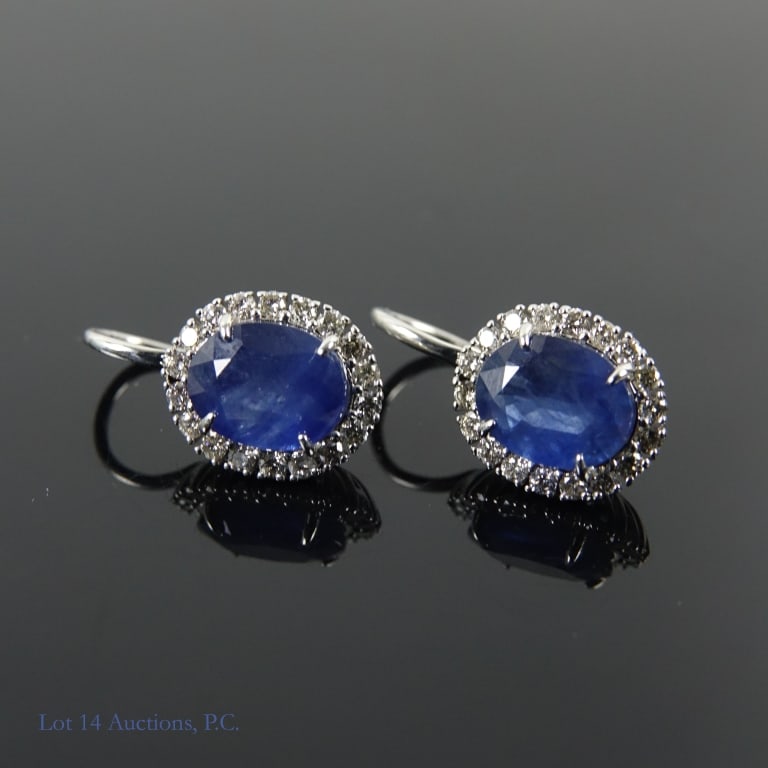 14k White Gold Sapphire and Diamond Drop Earrings: Pair of earrings made with 14k white gold, decorated with one sapphire and 18 diamonds EACH (5.01 cttw sapphires, 0.63 cttw diamonds). Total weight of both earrings is approximately 3.91g.