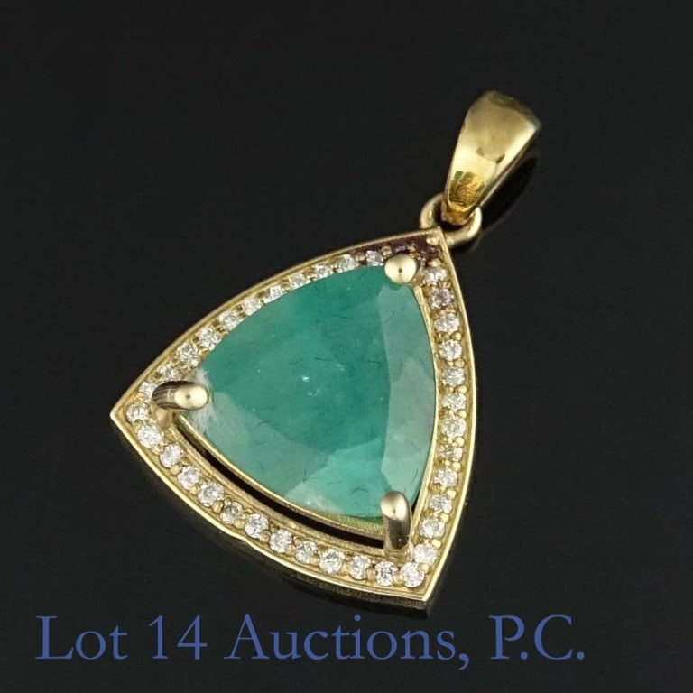 14k Y Gold Emerald & Diamond Pendant: 14k yellow gold pendant holding a large emerald surrounded by diamonds (3.00 cttw emerald, 0.15 cttw diamonds). Total weight of pendant is approximately 3.01g. Identification and appraisal report