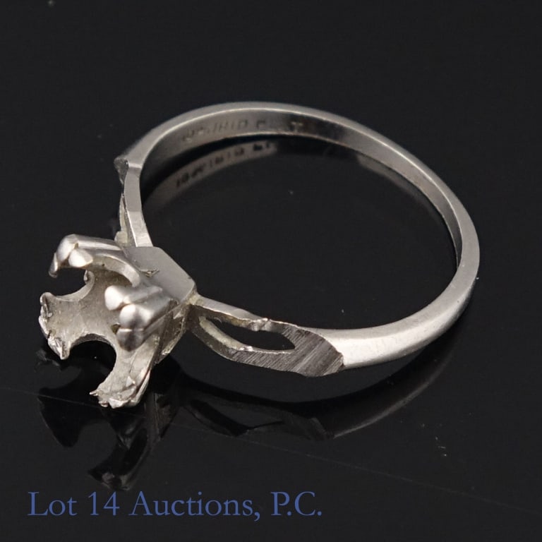 Platinum Ring Setting: Ring setting (gemstones have been removed). Marked "10% Irid Plat." (90% platinum alloy). Tests electronically as platinum. Size: 5.5. Weight: 2.65 grams.
