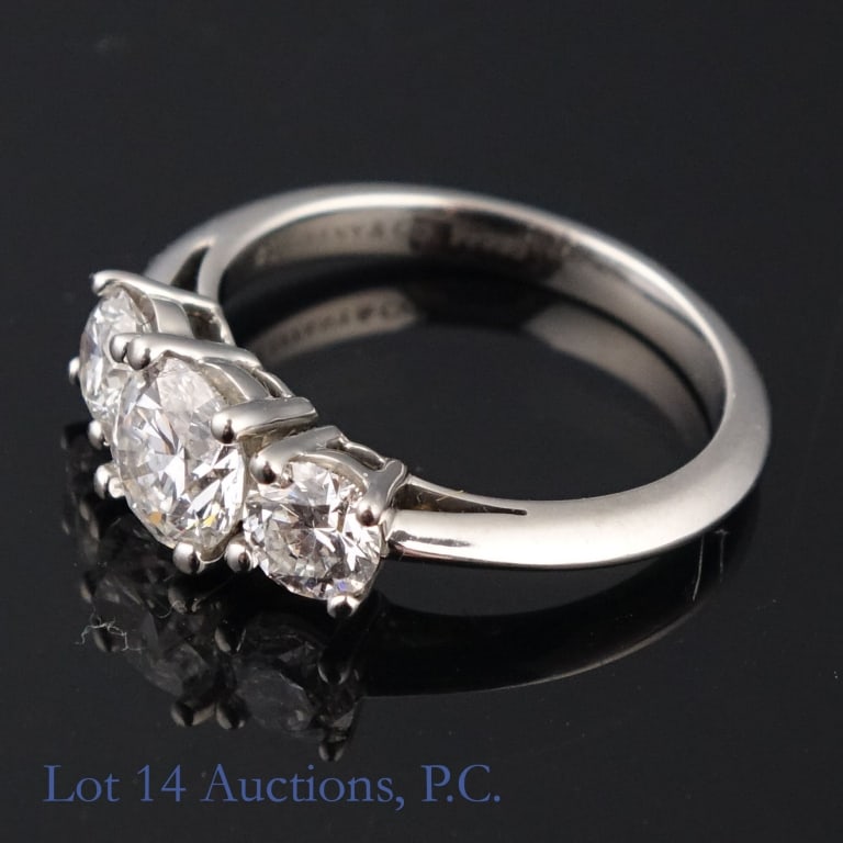 Tiffany & Co Platinum 3 Diamond Engagement Ring: 3-diamond engagement ring. Stamped: "Tiffany & Co. Pt 950". Size: between 4.5 & 4.75. Weight: 5.0 grams. Metal tests electronically as platinum, and stones test electronically as diamond. Comes with