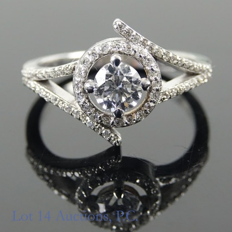 14k W Gold Diamond Ring: Size 6 engagement ring made with 14k white gold, decorated with diamonds (0.45 center stone. 0.28 cttw). Total weight of ring is approximately 3.39g. Identification and appraisal report from the Unifi