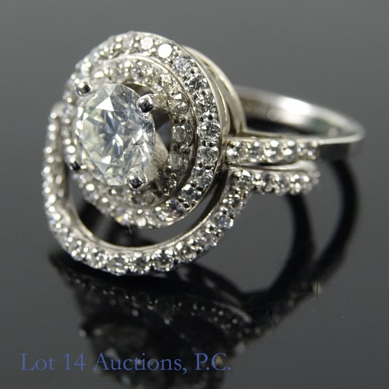 14k W Gold Diamond Ring Set w/ ID: Set of 2 size 6 bridal style rings made with 14k white gold, decorated with diamonds (0.70 ct center stone, 0.70 cttw side stones). Total weight of both rings is approximately 5.81g. Identification