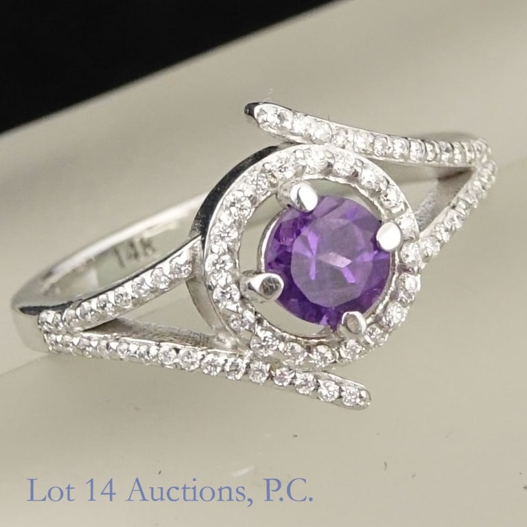 14k White Gold Diamond & Amethyst Ring: Size 6 ring made with 14k white gold, decorated with one amethyst and many small diamonds (0.45 amethyst, 0.28 cttw diamonds). Total weight of ring is approximately 3.21g. Identification and