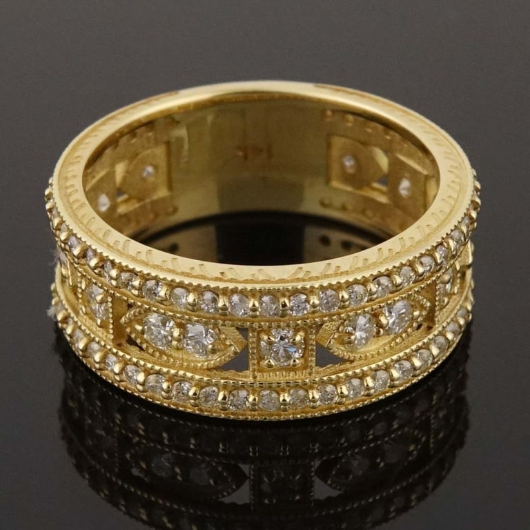 14k Yellow Gold Band Diamond Ring: Size 6.5 band ring made with 14k yellow gold, decorated with diamonds (1.37 cttw). Total weight of ring is approximately 5.1g. Identification and appraisal report from the Unified Gemological