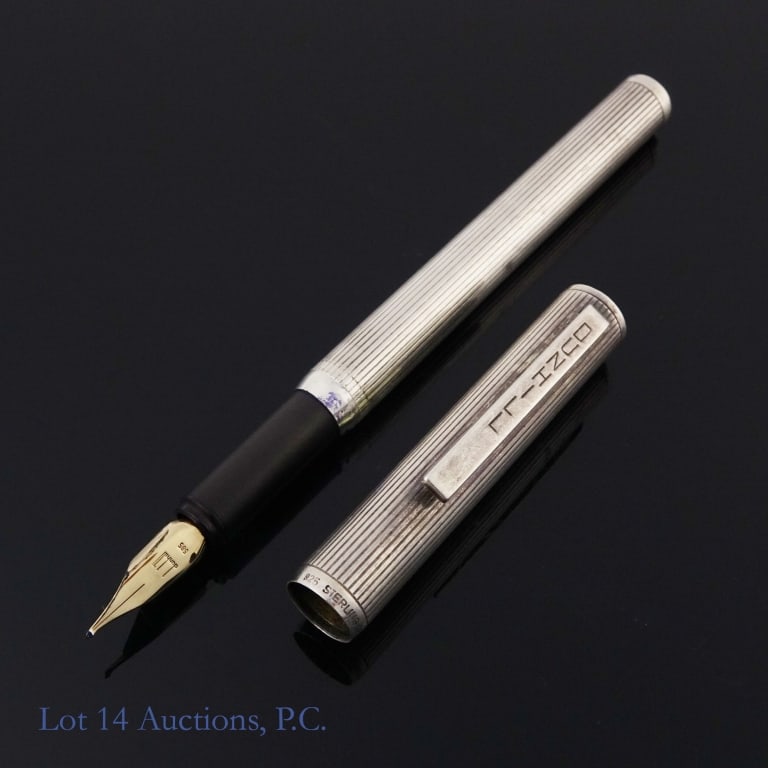 Dunhill Sterling Silver Fountain Pen 14K Nib: Dunhill sterling silver fountain pen with 14K gold nib. Wear present o the entire body, most notably a dent on the middle. See photos for details.