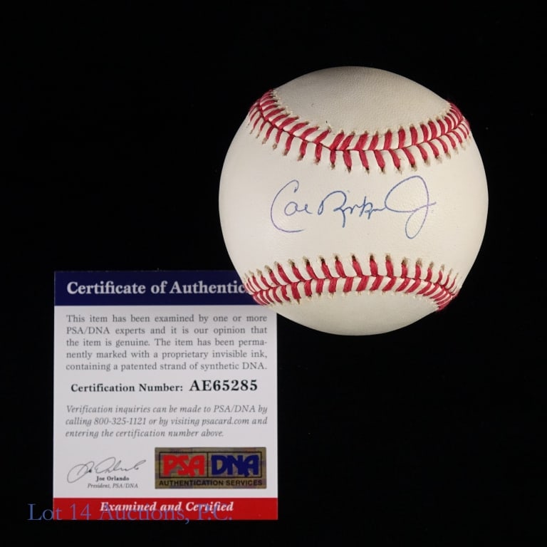 Orioles Cal Ripken Jr. Signed Baseball PSA COA: OAL Brown baseball signed across the sweet spot by Cal Ripken Jr. Ripken signed with a blue ballpoint pen. The ball has a very faint off white color and the signature has been authenticated by PSA/DNA