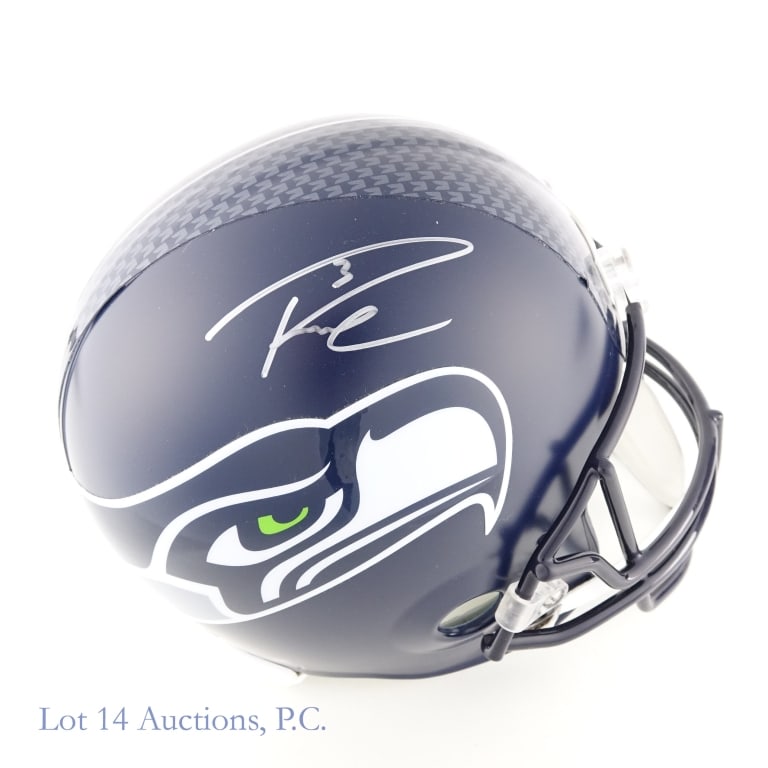 Russell Wilson Signed FS Seahawks Helmet (Beckett): Riddell full sized replica Seattle Seahawks helmet. Signed in silver sharpie on the right side by Russell Wilson (inscribed "3"). Beckett Witnessed (WE95516) sticker on back of helmet and accompanying