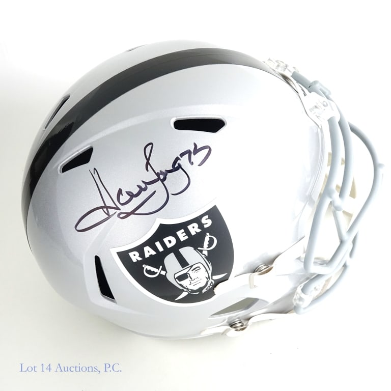 Howie Long Sig FS LV Raiders Helmet (Beckett): Riddell full sized replica Las Vegas Raiders helmet. Signed on the right side in black sharpie by Howie Long (inscribed "75"). Beckett witnessed sticker on back of helmet (WU04354). We have verified t