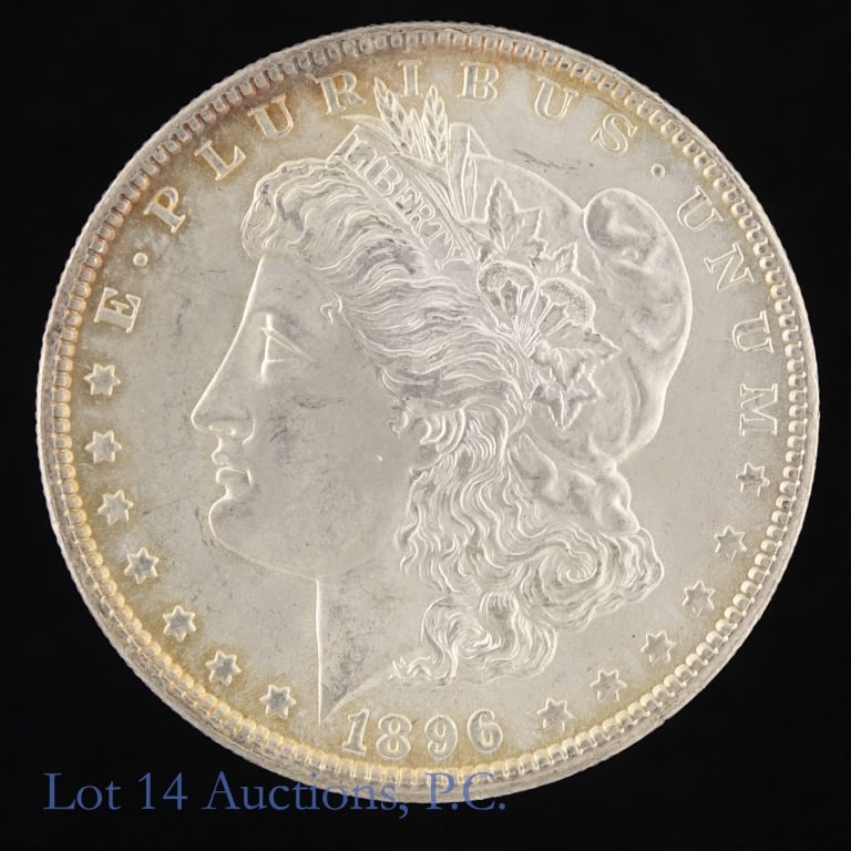 1896 (P) US Silver Morgan Dollar (*CH BU): 1896 (P) United States silver Morgan dollar (Philadelphia Mint). *Per consigner, clean cheek in CH BU condition with light toning. Metal is 90% silver. Mintage 9,976,000. *** Lot 14 Auctions is not a 